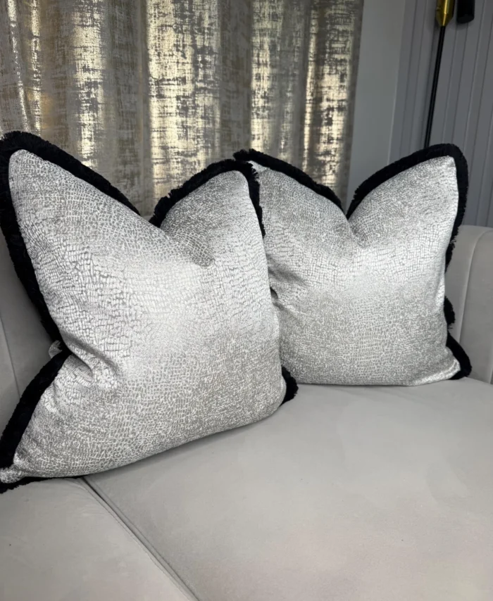 Luxury silver grey textured cushion cover with black contrast trim, modern neutral throw pillow cover styled upright against white background