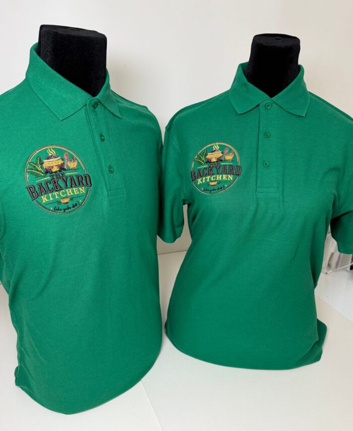 Close-up of premium green embroidered polo tops featuring the “Yebu Didi” logo on the left chest. Smart and professional short sleeve polo shirts designed for restaurant staff, food businesses, catering teams, and hospitality uniforms. High-quality embroidery with a clean finish on soft, comfortable fabric, displayed neatly for a modern branded workwear look